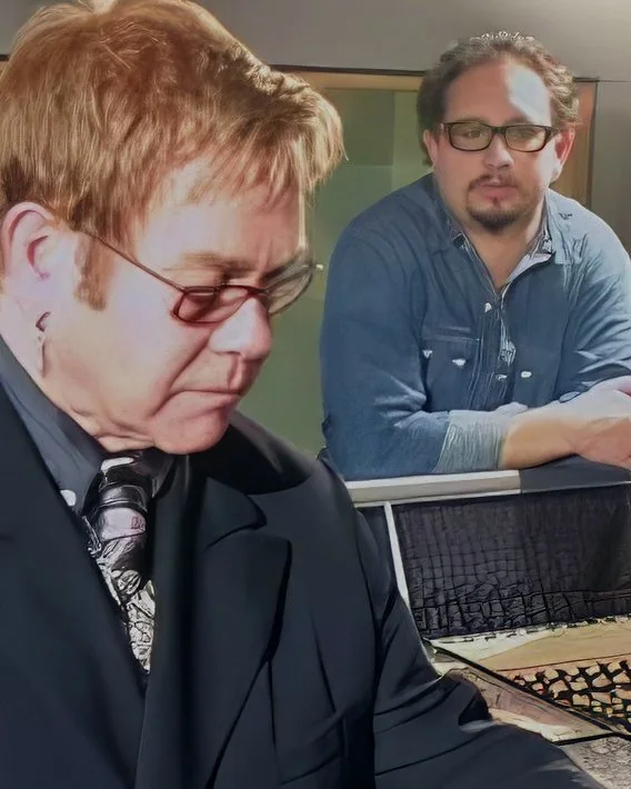 Elton John at Whitfield Studios, London, with Rocco behind him